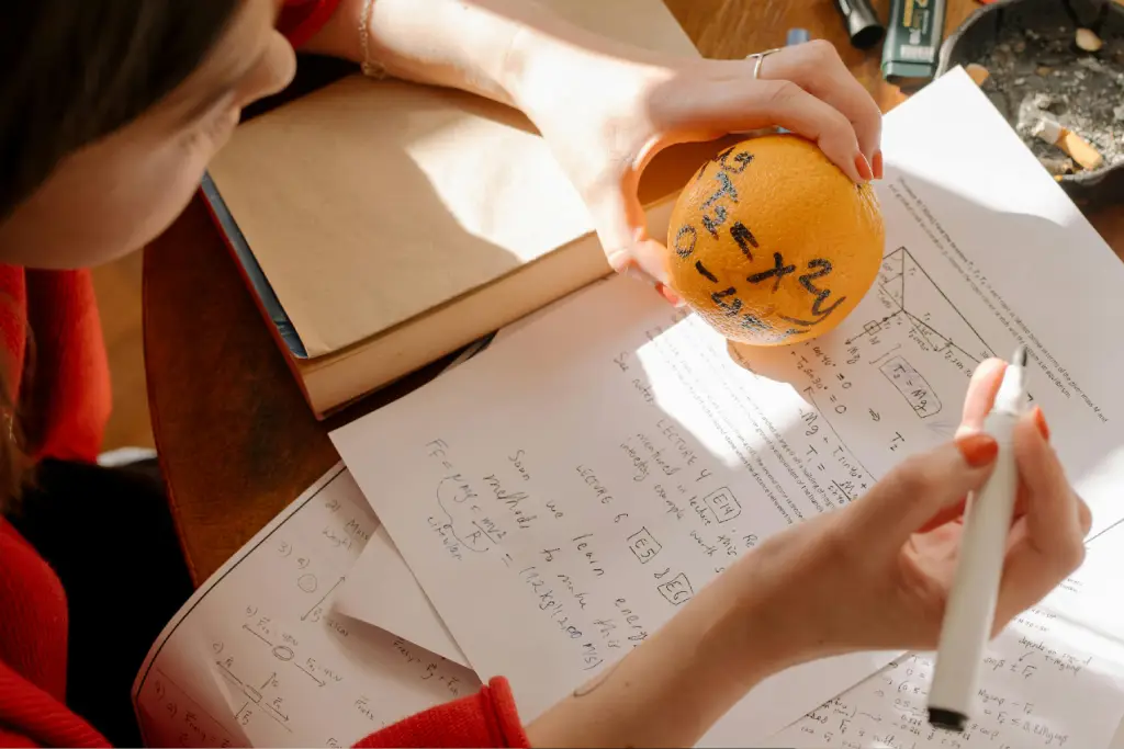 Studying math with equations on orange. Studying math with equations on orange.
