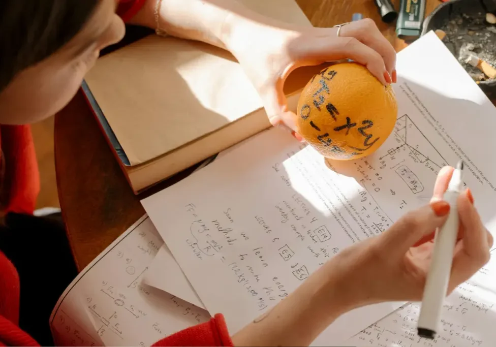 Studying math with equations on orange. Studying math with equations on orange.