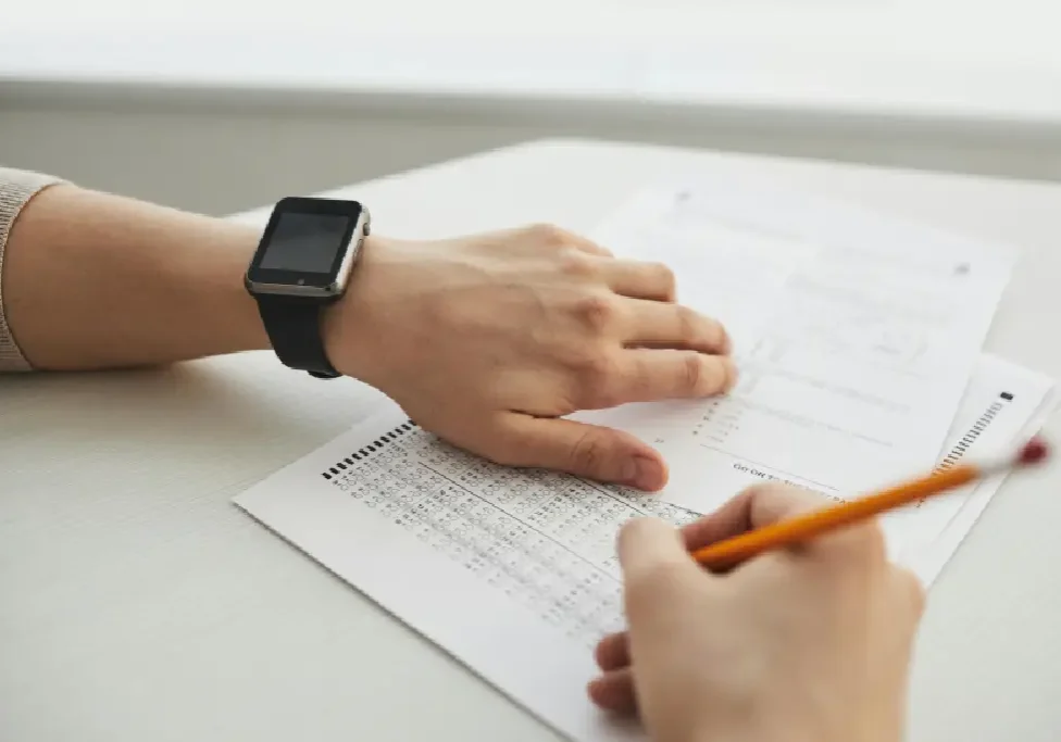 Person taking a test with pencil. Person taking a test with pencil.